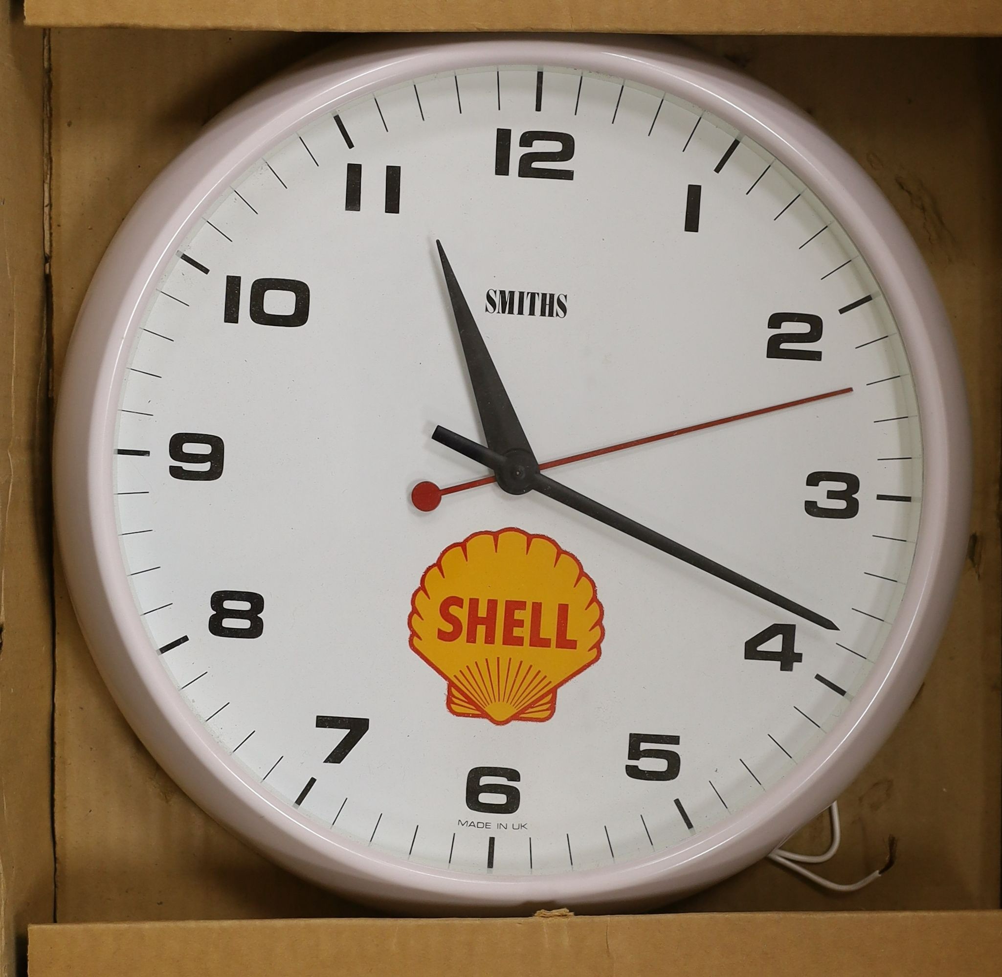 A Smith's 'Shell' advertising wall clock, 32 cms diameter.